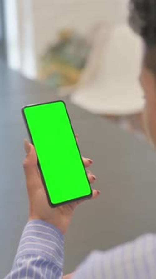 African Woman Using Green Screen Smartphone, vertical video