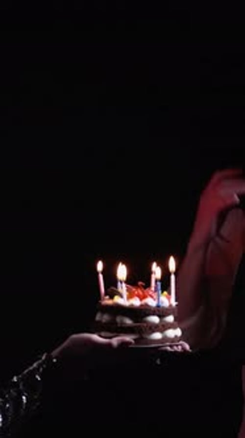 Couple Celebrates Birthday with Cake and Candles