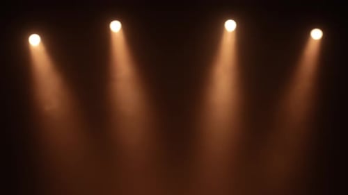 Bright Spotlights Beam From Professional Lighting Equipment Sparkle in the Dark with Floating Smoke