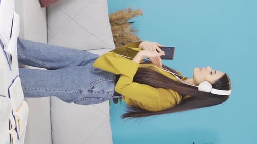 Enthusiastic Woman Dances to Music at Home