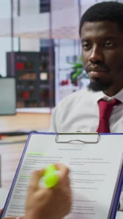 Adult Male Interviewed in Modern Office Environment