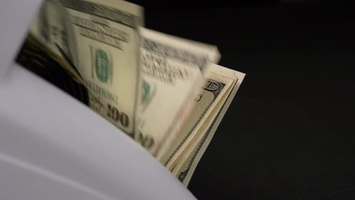 Money Counter Machine Counts US Hundred Dollar Bills