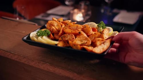Plate of Potato Wedges Appetizer at Restaurant