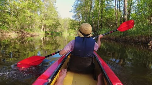 Passengers Pov Rowing In River On Tandem Canoe