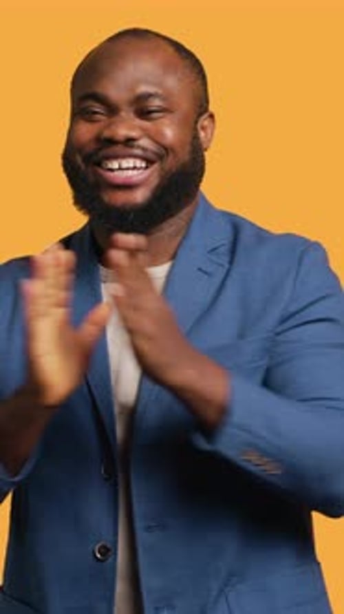 Vertical Video Man Happily Clapping Hands Applauding Studio Background