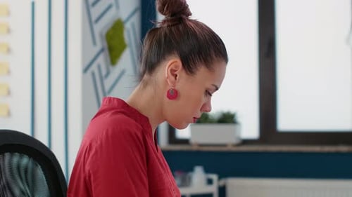 Woman Working at Desk in Modern Office