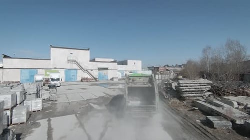 Municipal Recycling Garbage Collector Truck Driving Through the Industrial Area