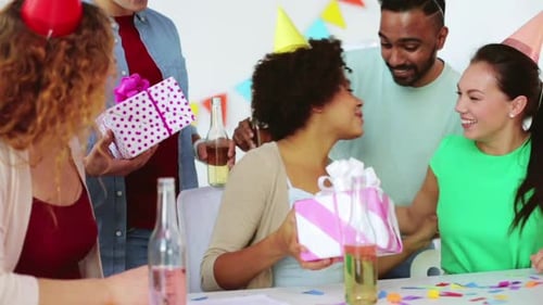 Friends Celebrating Birthday with Gifts and Drinks
