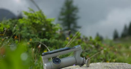 Insta360 Flow Pro On Rock Outdoor - Foldable AI Tracking Gimbal Stabilizer. tilt-down reveal