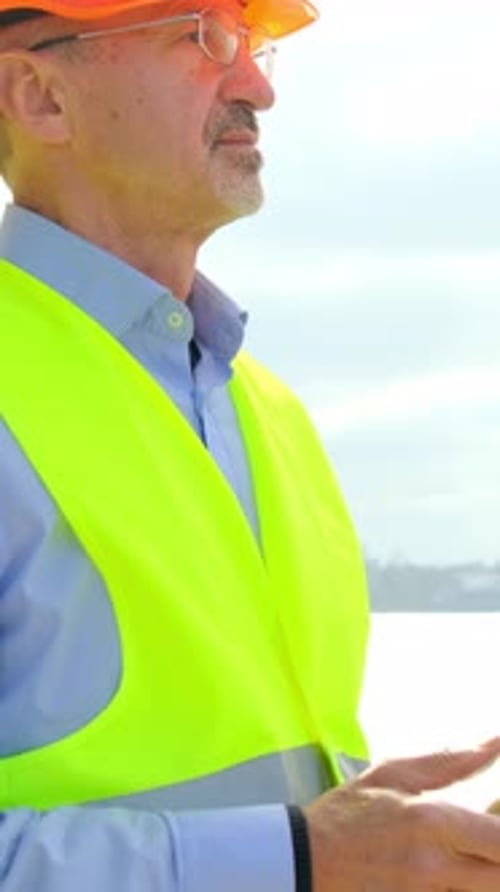 Port Worker at Construction Engineer Controls Vessel Repair