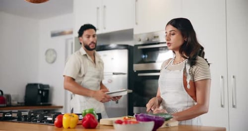 Couple Preparing Food Together in Bright Kitchen