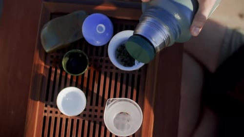 Tea Being Poured into White Tea Cup