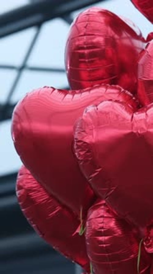 Red HeartShaped Balloons Tied Together