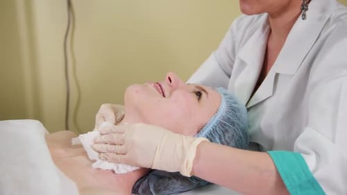 A Massage Treatment in Cosmetology Clinic The Doctor Wipes Out