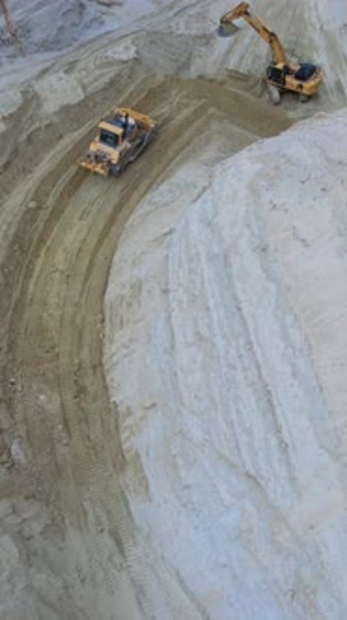 Bulldozer and Excavator at a Construction Site