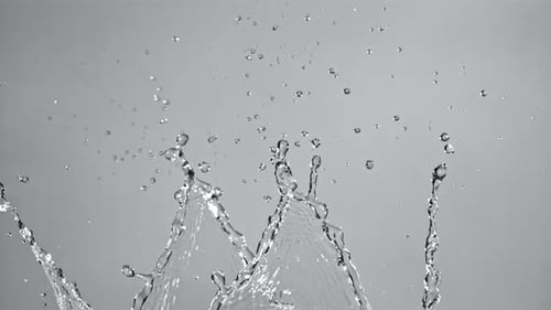 Splashing Water Isolated on Grey Background in Slow Motion