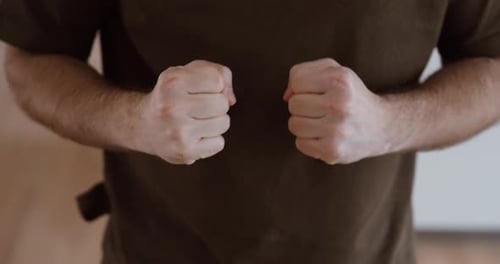 Clenched Fists Close Up – Anger and Tension Concept