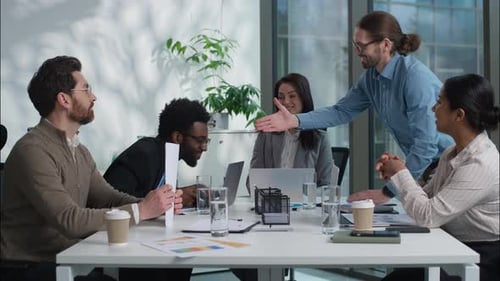 Diverse Team Collaborating at Modern Office Meeting
