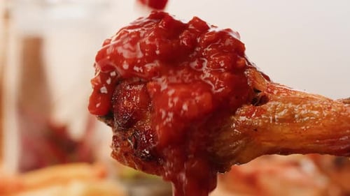Pouring Grill Bbq Piece of Chicken Kebab Over Red Tomato or Ketchup Sauce Closeup Eat Chicken Crispy