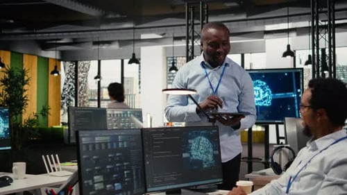 Smiling IT Staff Members in Office Using AI to Optimize Company Systems