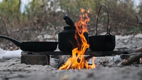 Cooking with Campfire in Rural Wilderness Setting