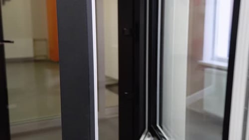 Friendly Manager in Window Shop Closes a Window