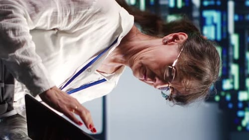 Woman Works on Tablet with Tech Background