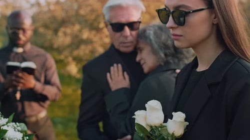 Mourners Gather at Outdoor Remembrance Ceremony