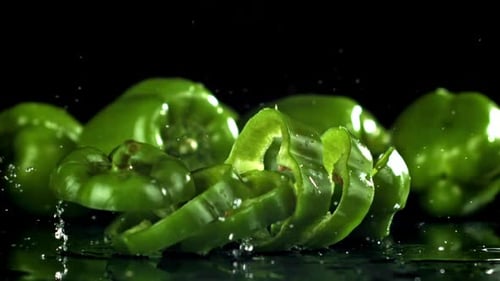 Juicy Green Peppers Arranged Beautifully on Shiny Table Filmed on a Highspeed Camera at 1000 Fps