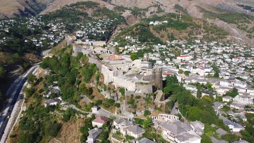 Aerial drone view of the old castle and fortress of the city of Gjirokaster or gjirokastra, Albania.