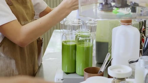 Healthy smoothie preparation juice bar food bright interior close-up view wellness concept