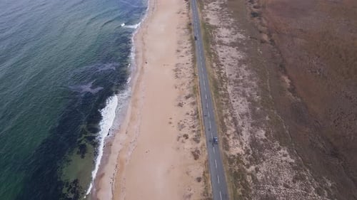 View of the Road Along the Sea Sandy Coast From the Drone