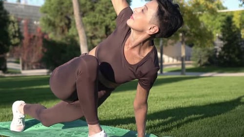 Woman Doing Yoga Exercise in Green Park