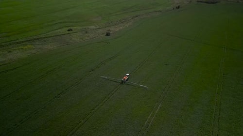 Spray Fertilize On Field With Chemicals In Agriculture Field