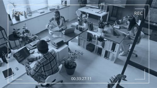 CCTV View of Team of Diverse Programmers Discussing Project in Office