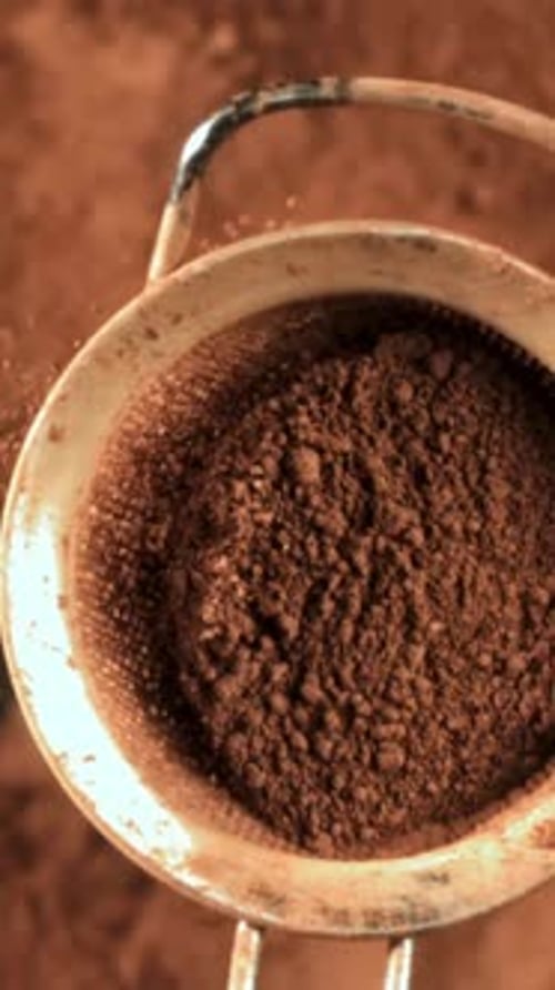 Cocoa Powder is Sifted Through a Sieve Filmed on a Highspeed Camera at 1000 Fps