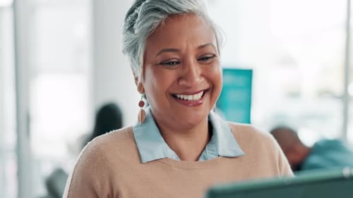 Smile, reading and mature woman with tablet in office, research and social media for planning
