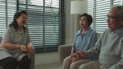 Seniors Talking Together in a Bright Living Room