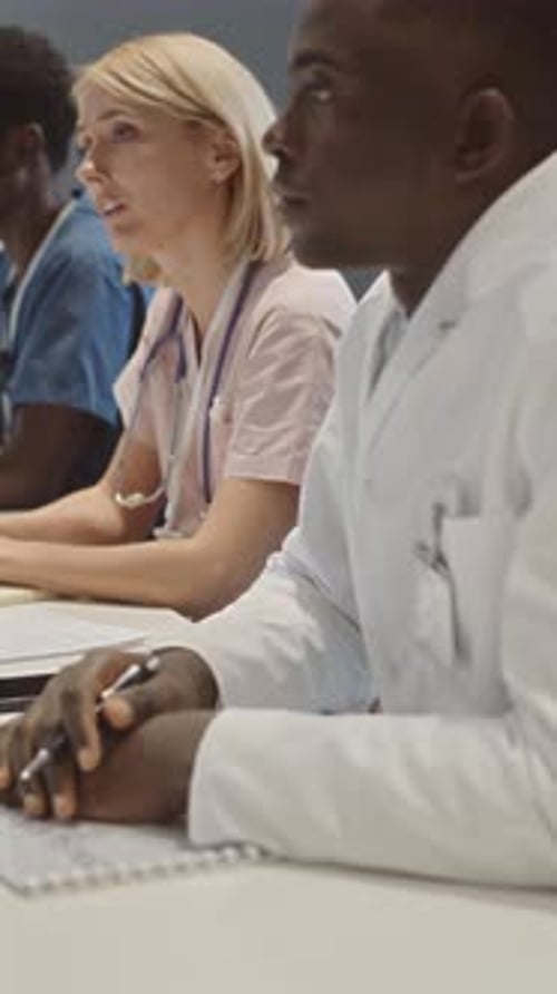 Medical Professionals Gather at Conference Table