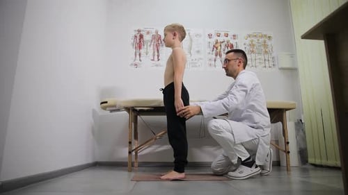 Doctor Examines Young Patient in Clinic