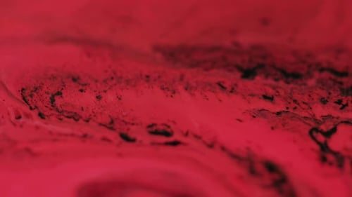 Abstract Dark Ink Swirling in Viscous Red Liquid