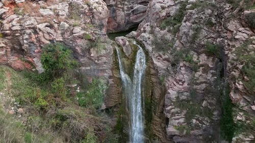 Scenic Waterfall Cascading Down Rocky Cliffside
