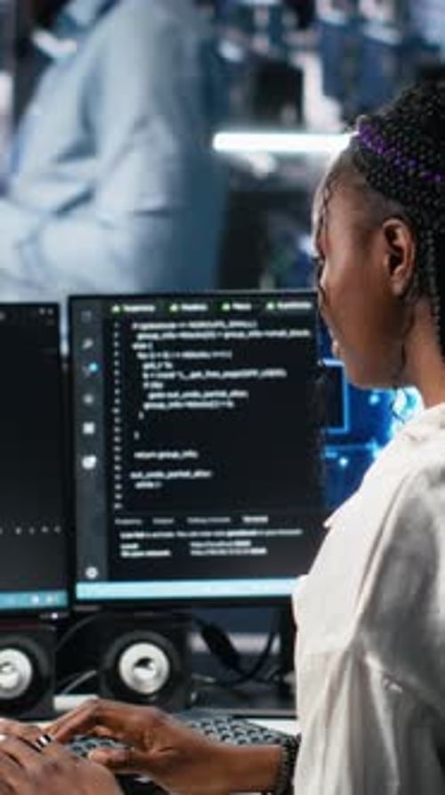 Vertical Video Technicians in Data Center Review AI Diagnostics Analyzing Neural Networks