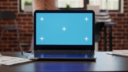 Laptop with Greenscreen Background in Startup Business Workplace