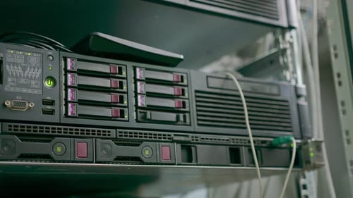 A rack-mounted computer server in a data center room in a hotel or technology enterprise digital