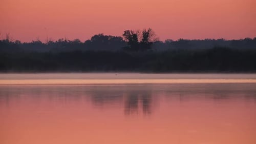 Sunrise over lake and beautiful morning landscape