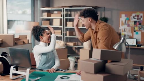 Cheerful Young Adults Working Together in Bright Urban Office