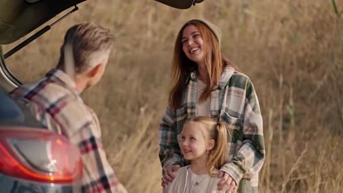 Closeup Shot of a Happy Brunette Girl in a Green Plaid Shirt Hugging Her Little Daughter and