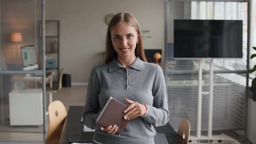 Portrait of Young Female Employee in Modern Office