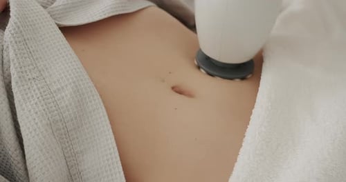Abdomen Massage with Massager in Beauty Spa